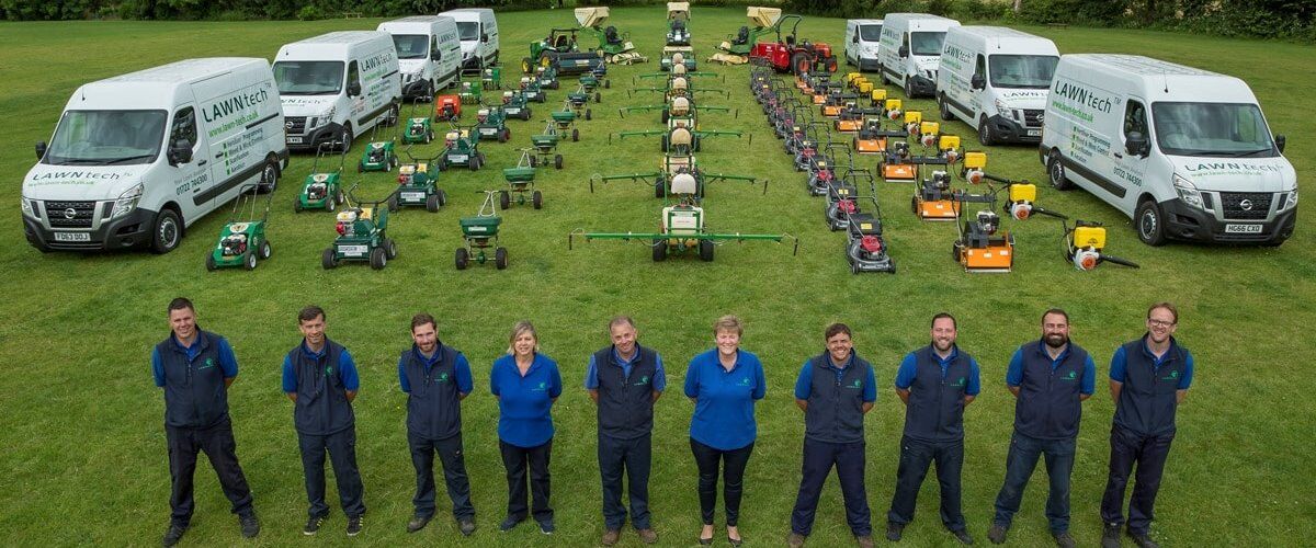 Lawntech team with machines and vehicles