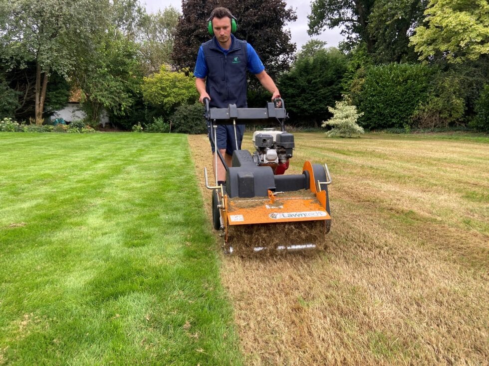 A technician carrying out lawn care